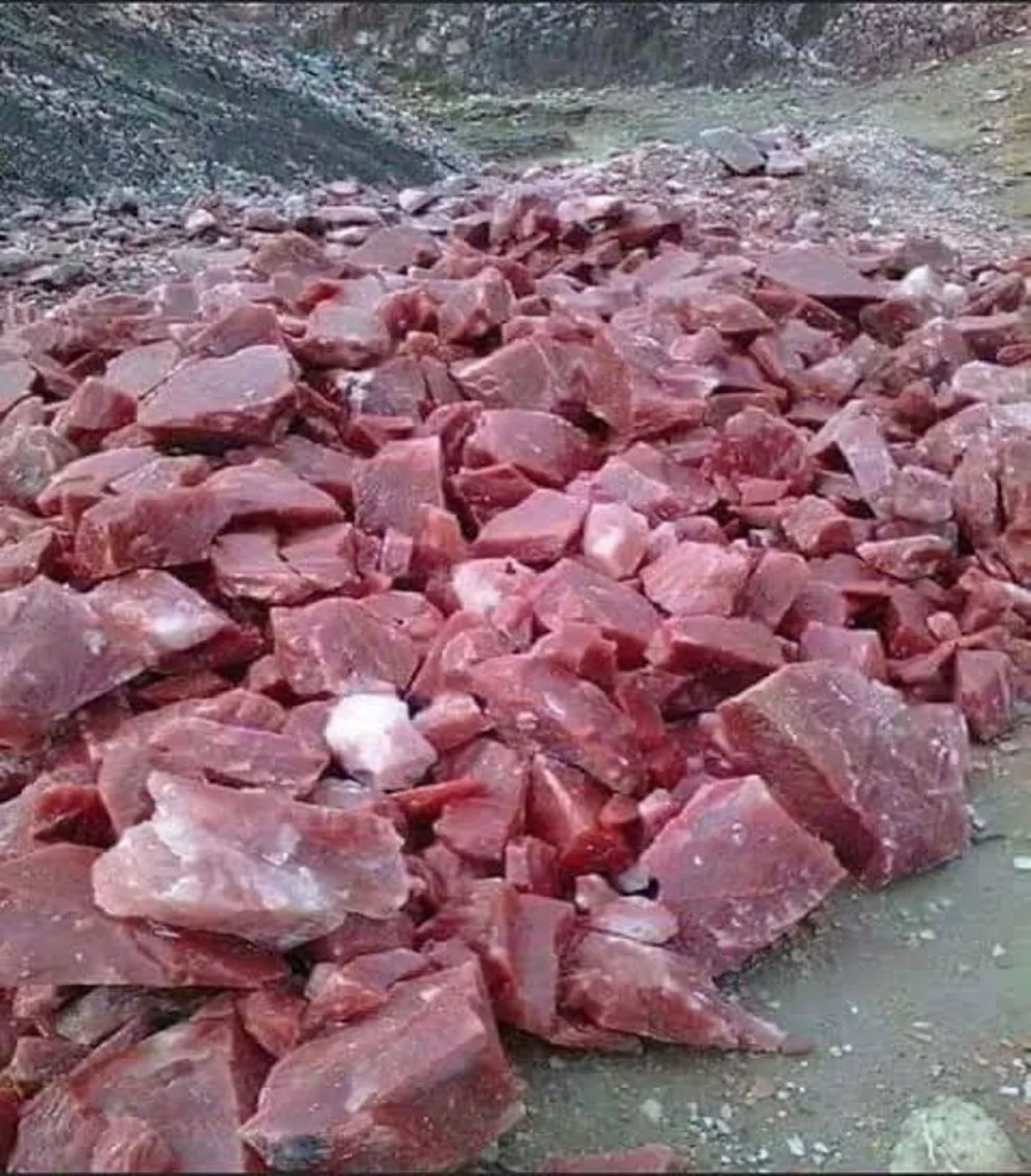 Freshly broken dark pink rock salt heaped at the Kalabagh workings.